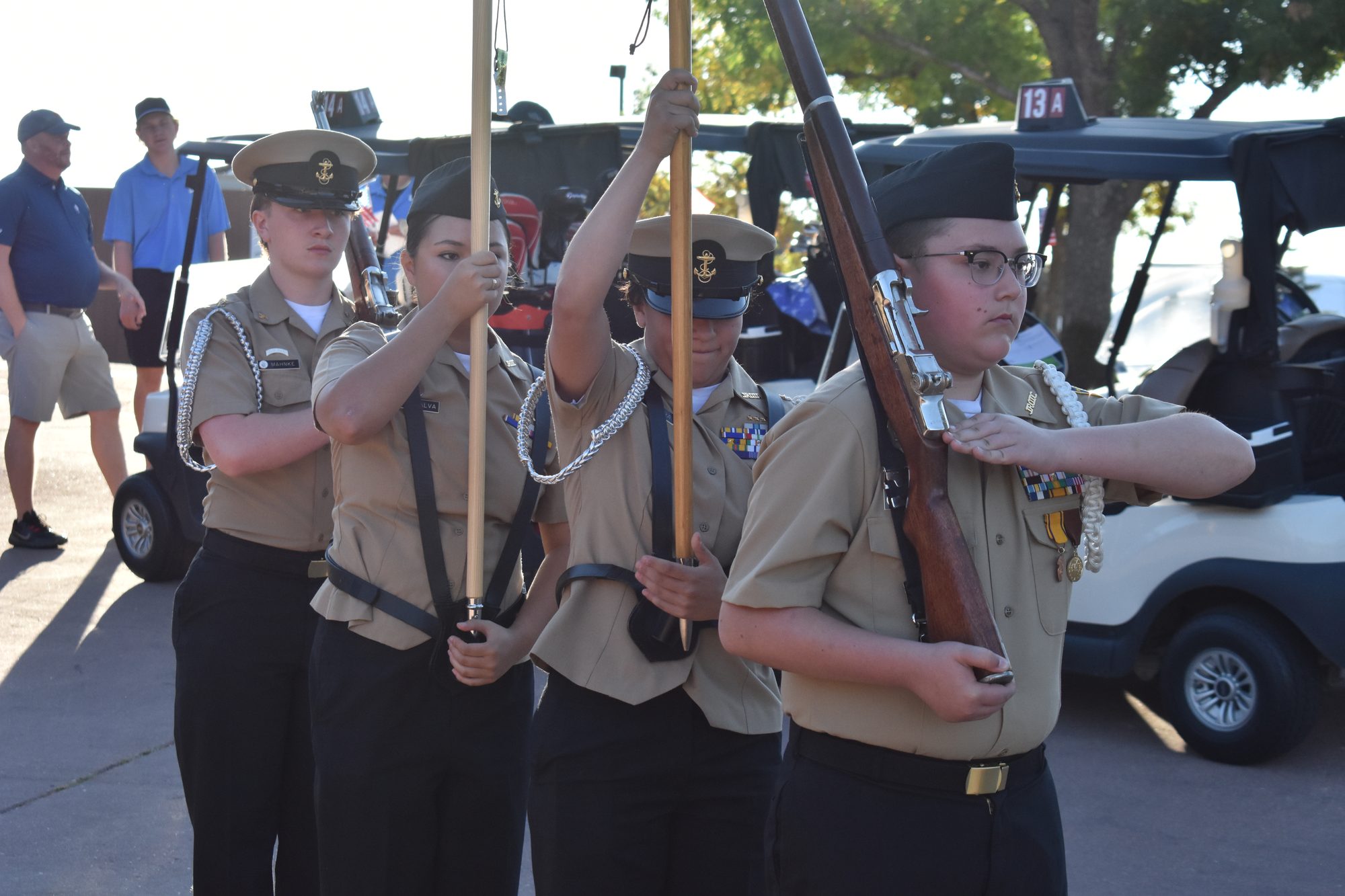 Junior ROTC cadets standing at attention with the colors at an ALYP event
