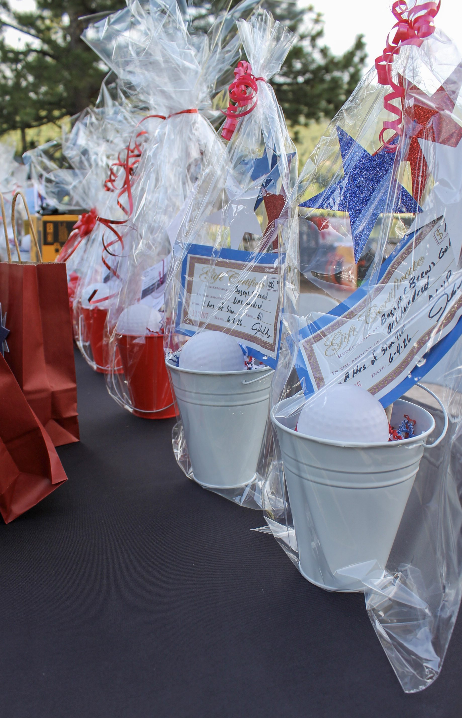 Prize buckets and gift baskets on the auction table